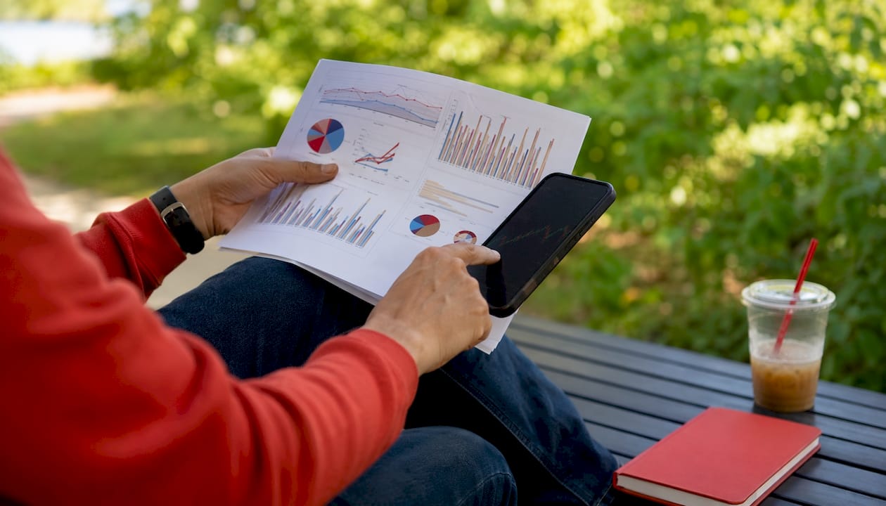 Hands reviewing restaurant sector short interest data