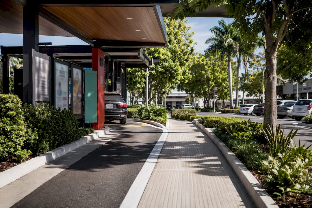 Drive-thru lane with raised curbs and pedestrian paths